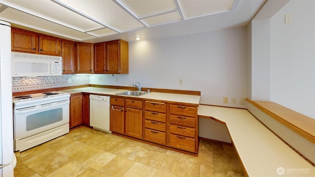 424 14th St # 202, Bellingham, WA 98225 - kitchen featuring white appliances, brown cabinets, light countertops, and tasteful backsplash