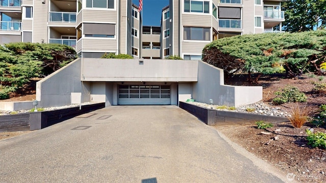 424 14th St # 202, Bellingham, WA 98225 - view of building exterior featuring asphalt driveway and an attached garage