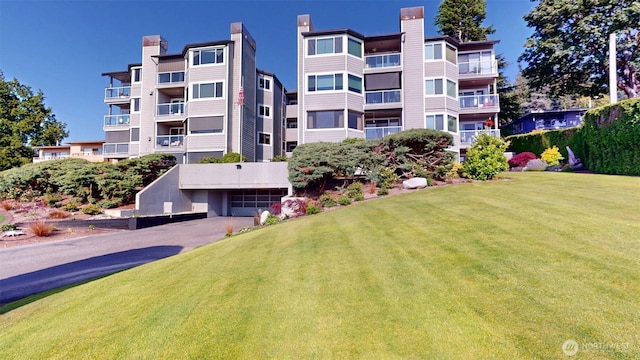 424 14th St # 202, Bellingham, WA 98225 - view of apartment building / complex with a garage and asphalt driveway