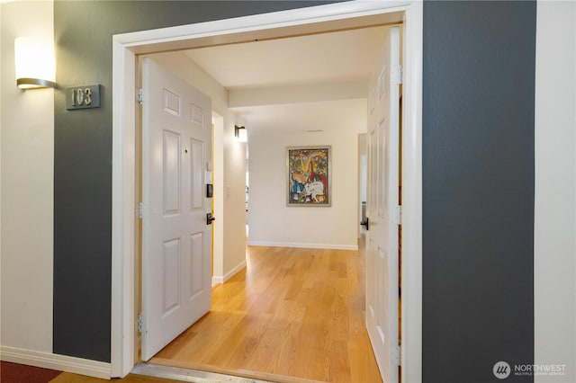 2565 Dexter Ave N Unit 103, Seattle, WA 98109 - corridor with light wood-style floors and baseboards