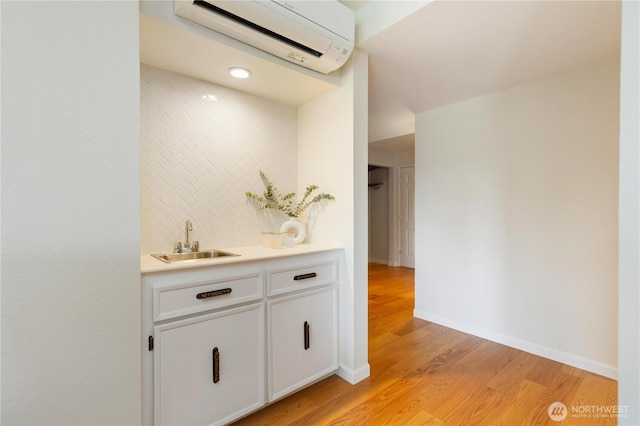 2565 Dexter Ave N Unit 103, Seattle, WA 98109 - corridor featuring a wall mounted air conditioner and light wood-style flooring
