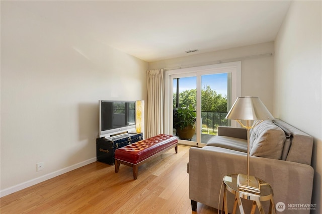 2565 Dexter Ave N Unit 103, Seattle, WA 98109 - living area with light wood-style flooring and baseboards