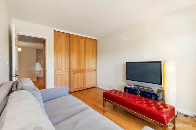 2565 Dexter Ave N Unit 103, Seattle, WA 98109 - living area with light wood-style flooring and baseboards