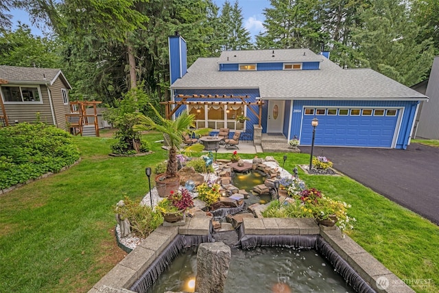 20814 28th Ave SE, Bothell, Bothell, WA 98021 - view of front facade featuring a garden pond, a chimney, a garage, asphalt driveway, and a front yard
