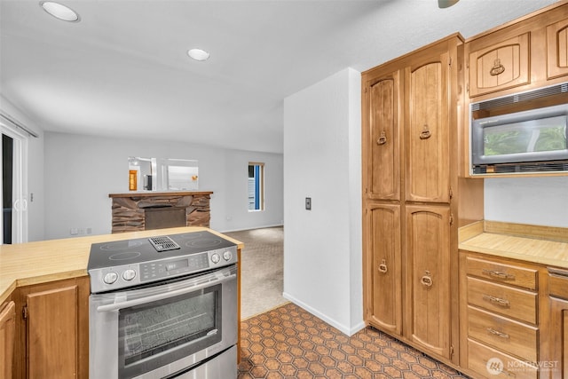 20814 28th Ave SE, Bothell, Bothell, WA 98021 - kitchen featuring stainless steel electric range oven, built in microwave, open floor plan, brown cabinetry, and recessed lighting