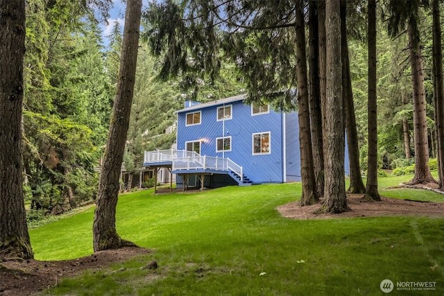 20814 28th Ave SE, Bothell, Bothell, WA 98021 - back of property with a deck, stairway, a yard, a chimney, and a view of trees