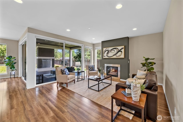 10526 SE 277th Pl, Kent, WA 98030 - living room featuring a glass covered fireplace, wood finished floors, and recessed lighting
