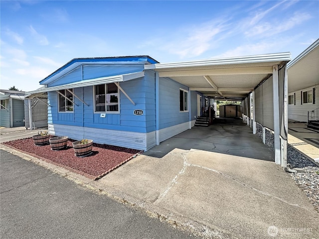 1385 Samuel Dr, Walla Walla, WA 99362 - manufactured / mobile home featuring driveway and a carport