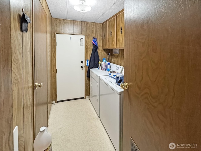 1385 Samuel Dr, Walla Walla, WA 99362 - washroom featuring washer and clothes dryer, wooden walls, and a textured ceiling
