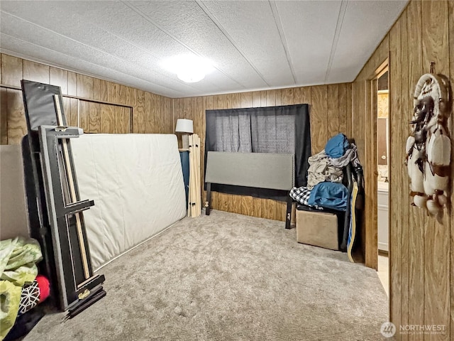 1385 Samuel Dr, Walla Walla, WA 99362 - bedroom featuring wooden walls and carpet flooring