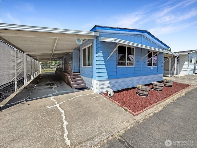 1385 Samuel Dr, Walla Walla, WA 99362 - manufactured / mobile home featuring an attached carport and driveway
