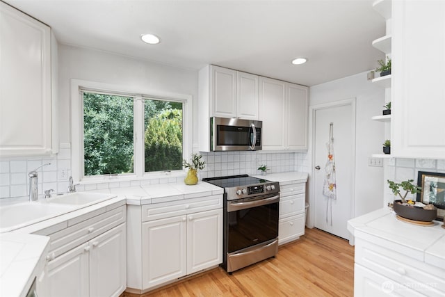 2322 Browns Point Blvd NE, Tacoma, WA 98422 - kitchen featuring stainless steel appliances, open shelves, white cabinetry, tile counters, and recessed lighting