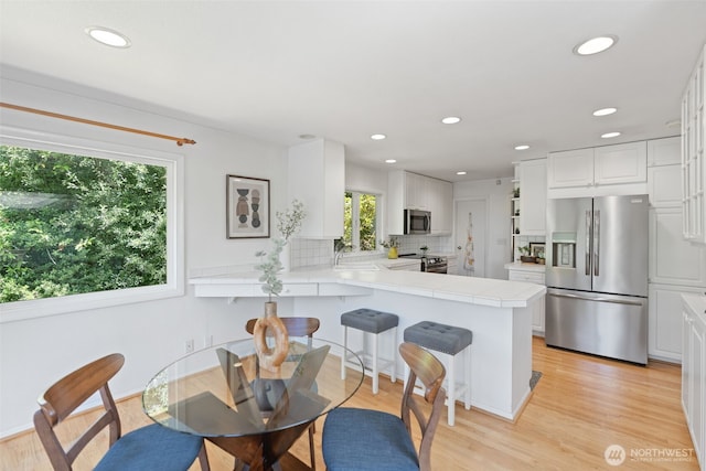 2322 Browns Point Blvd NE, Tacoma, WA 98422 - dining space featuring recessed lighting and light wood-type flooring
