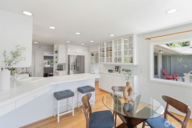 2322 Browns Point Blvd NE, Tacoma, WA 98422 - dining space with light wood-type flooring, recessed lighting, and healthy amount of natural light