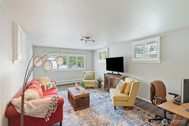 2322 Browns Point Blvd NE, Tacoma, WA 98422 - living room with a baseboard heating unit, wood finished floors, and a desk