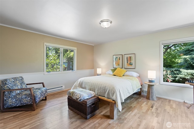 2322 Browns Point Blvd NE, Tacoma, WA 98422 - bedroom with multiple windows, wood finished floors, a baseboard heating unit, and crown molding