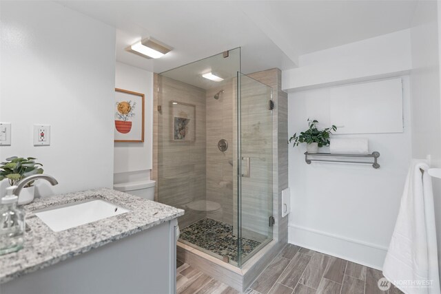 2322 Browns Point Blvd NE, Tacoma, WA 98422 - full bathroom with vanity, a stall shower, and wood finished floors