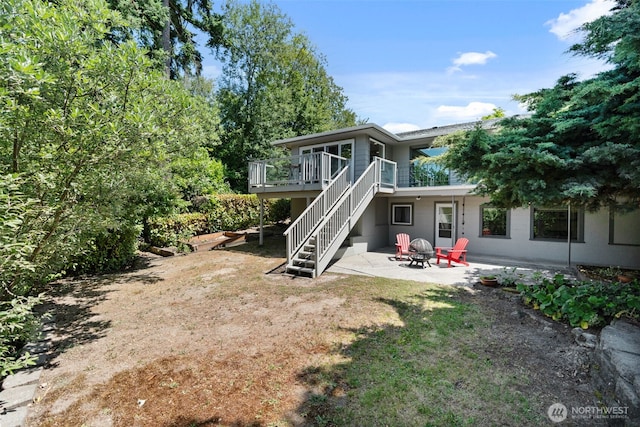 2322 Browns Point Blvd NE, Tacoma, WA 98422 - back of property with stairway, a patio area, a deck, and a fire pit
