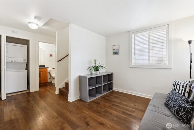 9013 16th Ave SW Unit 8, Seattle, WA 98106 - sitting room with stacked washer / drying machine, dark wood-style floors, and stairway