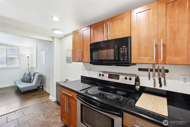 9013 16th Ave SW Unit 8, Seattle, WA 98106 - kitchen with electric range, black microwave, dark countertops, brown cabinets, and dark wood-type flooring