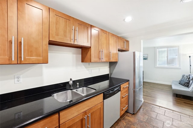 9013 16th Ave SW Unit 8, Seattle, WA 98106 - kitchen with dishwasher, recessed lighting, brown cabinetry, and dark stone countertops
