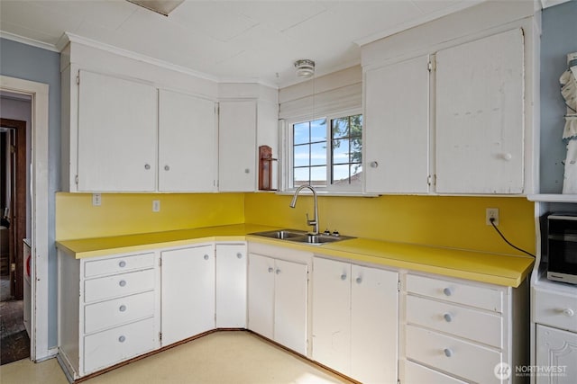 2991 Main St, Custer, WA 98240 - kitchen featuring crown molding, light countertops, and white cabinets