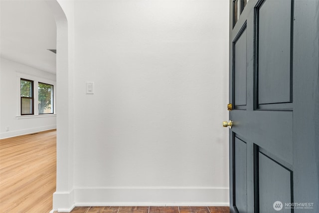 1816 S Adams St, Tacoma, WA 98405 - corridor with arched walkways and wood finished floors