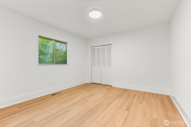 1816 S Adams St, Tacoma, WA 98405 - unfurnished bedroom with light wood-style floors and a closet