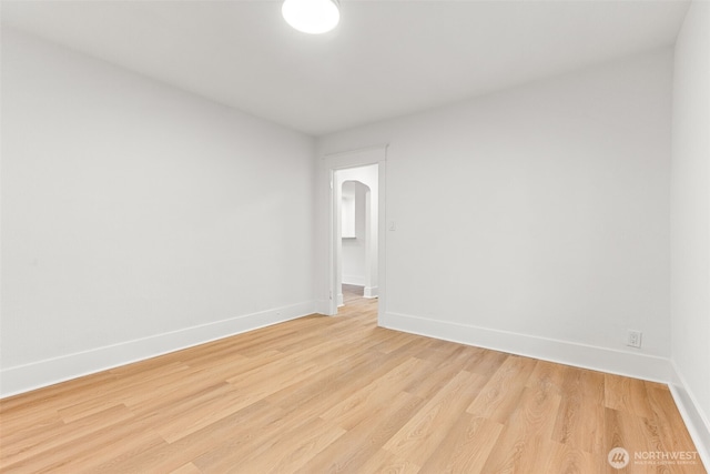 1816 S Adams St, Tacoma, WA 98405 - empty room featuring light wood-type flooring and arched walkways