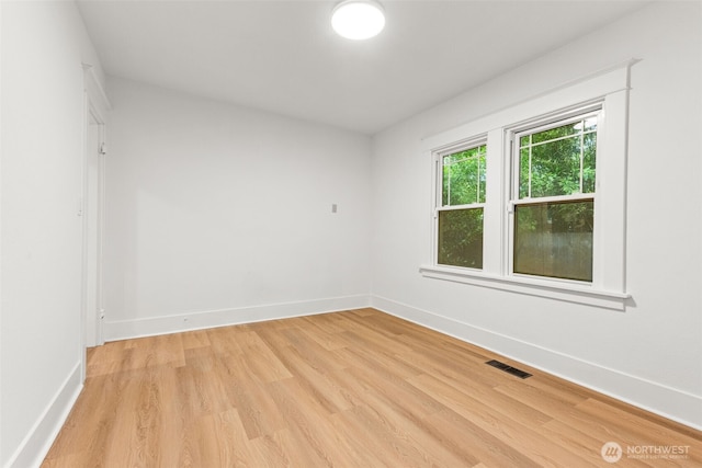 1816 S Adams St, Tacoma, WA 98405 - spare room with light wood finished floors and baseboards