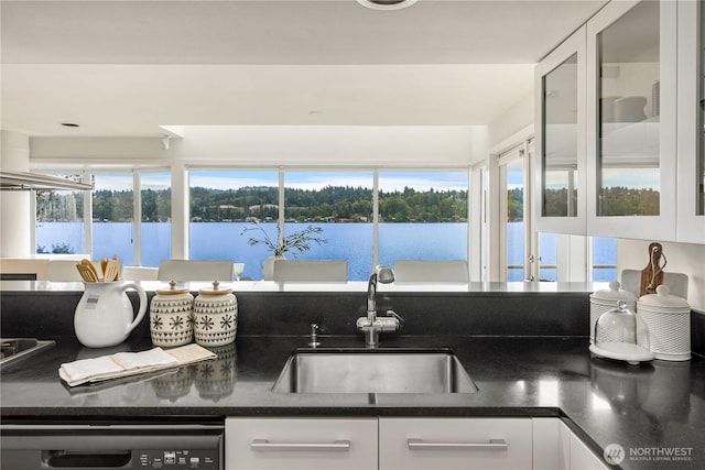 5438 E Mercer Way, Mercer Island, WA 98040 - kitchen with dishwashing machine, dark countertops, healthy amount of natural light, and white cabinets