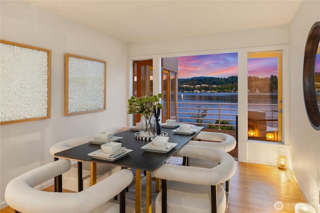 5438 E Mercer Way, Mercer Island, WA 98040 - dining room with wood finished floors and a water view
