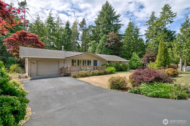 27521 U St, Ocean Park, WA 98640 - ranch-style home featuring asphalt driveway and an attached garage
