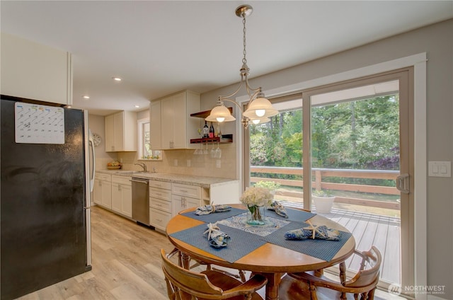 27521 U St, Ocean Park, WA 98640 - dining area with healthy amount of natural light, light wood finished floors, and recessed lighting