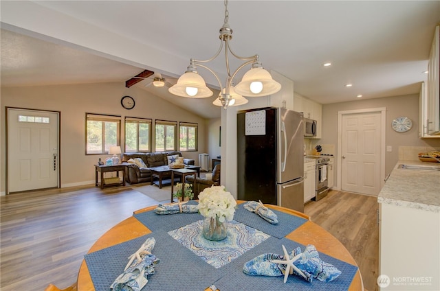27521 U St, Ocean Park, WA 98640 - dining room featuring light wood-style flooring, recessed lighting, and a chandelier