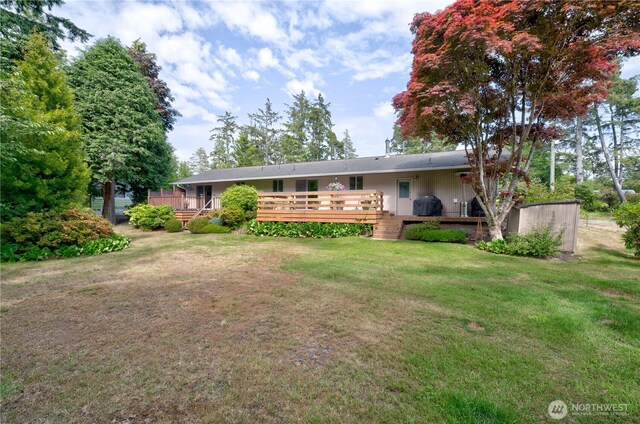 27521 U St, Ocean Park, WA 98640 - rear view of house featuring a lawn and a deck
