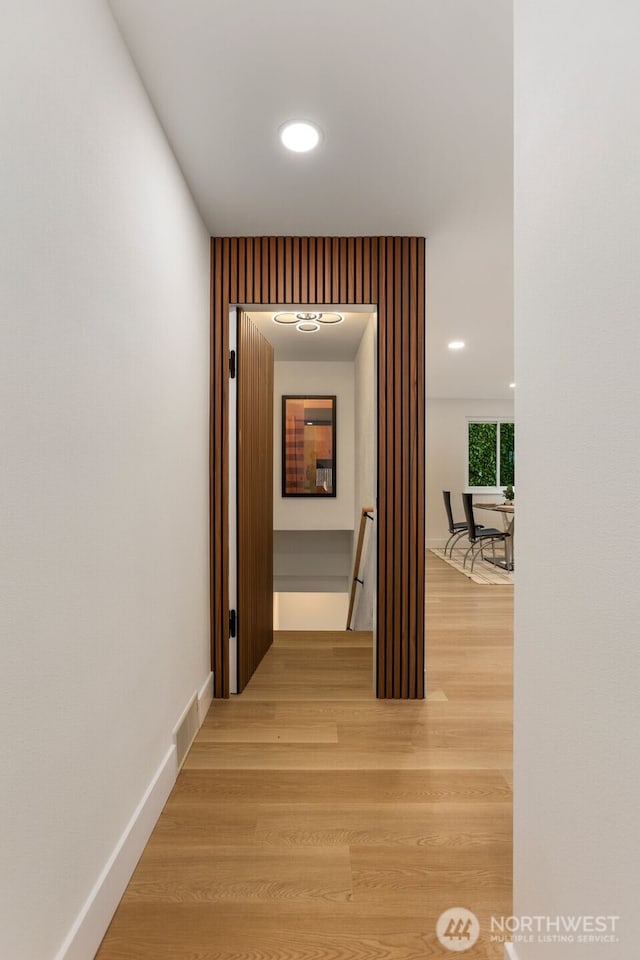 4839 S Holly St, Seattle, WA 98118 - hallway featuring light wood-type flooring, recessed lighting, and an upstairs landing