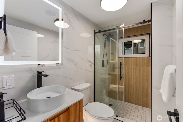 4839 S Holly St, Seattle, WA 98118 - bathroom featuring tile walls, a marble finish shower, and vanity