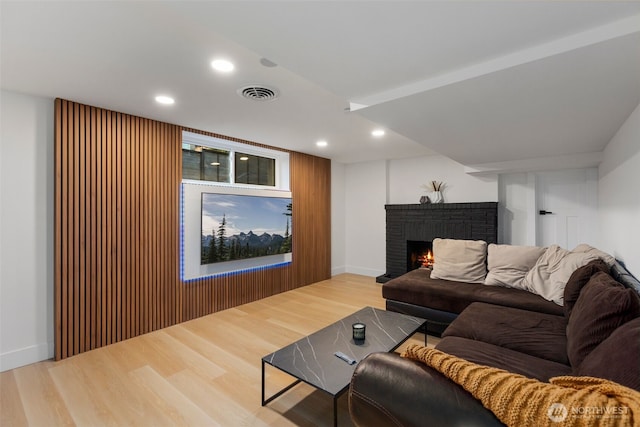 4839 S Holly St, Seattle, WA 98118 - living room featuring wood finished floors, a fireplace, and recessed lighting