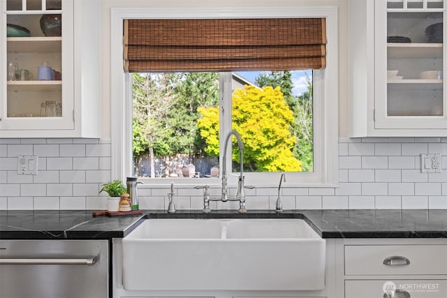 1424 E 36th Ln, Bellingham, WA 98226 - kitchen with dishwasher, white cabinetry, glass insert cabinets, and decorative backsplash