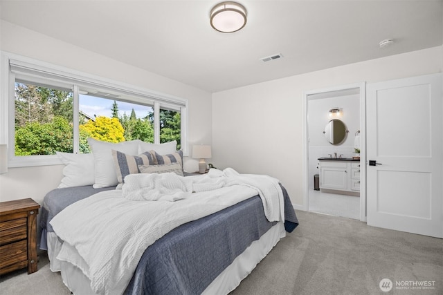 1424 E 36th Ln, Bellingham, WA 98226 - bedroom with light carpet and ensuite bath