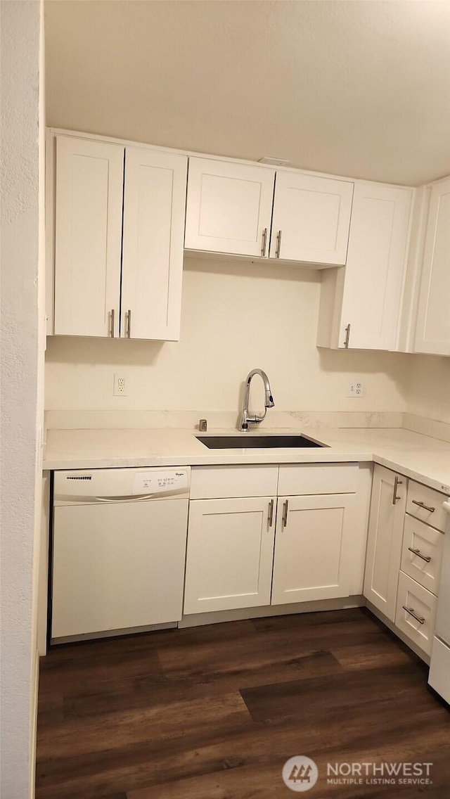 402 4th St SE, Auburn, WA 98002 - kitchen with white dishwasher, white cabinets, light countertops, and dark wood finished floors
