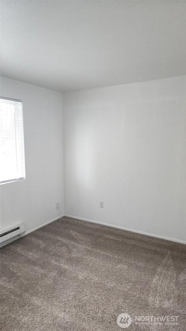 402 4th St SE, Auburn, WA 98002 - carpeted spare room with a baseboard heating unit and baseboards