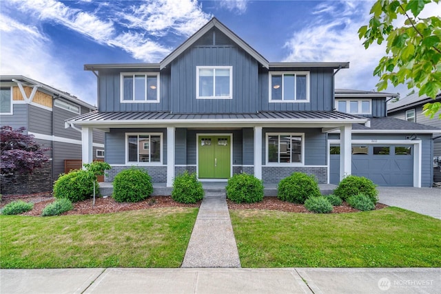 18611 134th St E, Bonney Lake, WA 98391 - view of front of home featuring board and batten siding, a standing seam roof, a porch, and a garage
