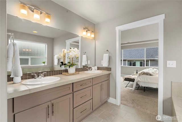 18611 134th St E, Bonney Lake, WA 98391 - ensuite bathroom featuring double vanity, tile patterned flooring, and backsplash