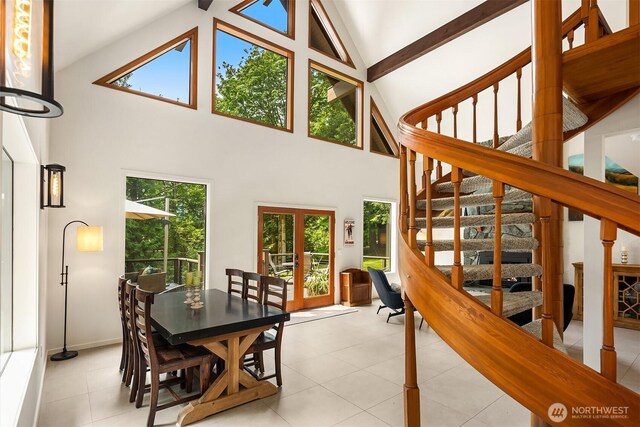25112 SE 17th St, Sammamish, WA 98075 - dining area with high vaulted ceiling, stairway, and light tile patterned floors