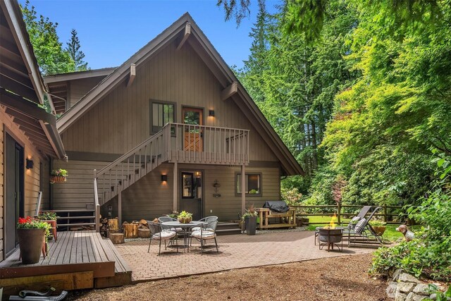 25112 SE 17th St, Sammamish, WA 98075 - rear view of house featuring stairs, a patio, a fire pit, and a deck