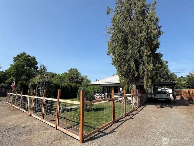 416 Cedar St S, Omak, WA 98841 - view of front of property with a detached carport, a metal roof, and asphalt driveway