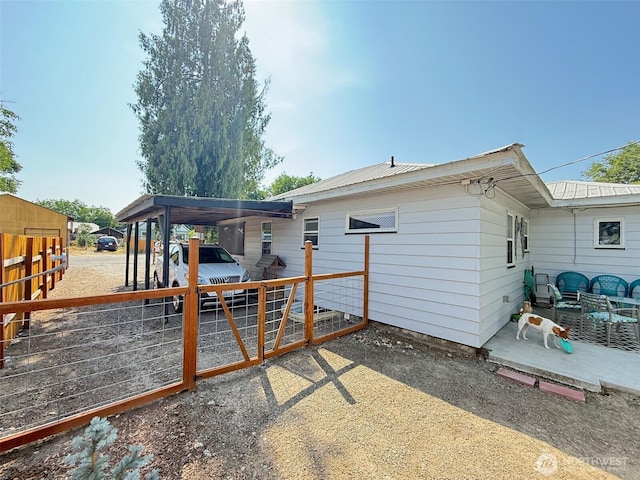 416 Cedar St S, Omak, WA 98841 - back of house featuring a patio area and a metal roof