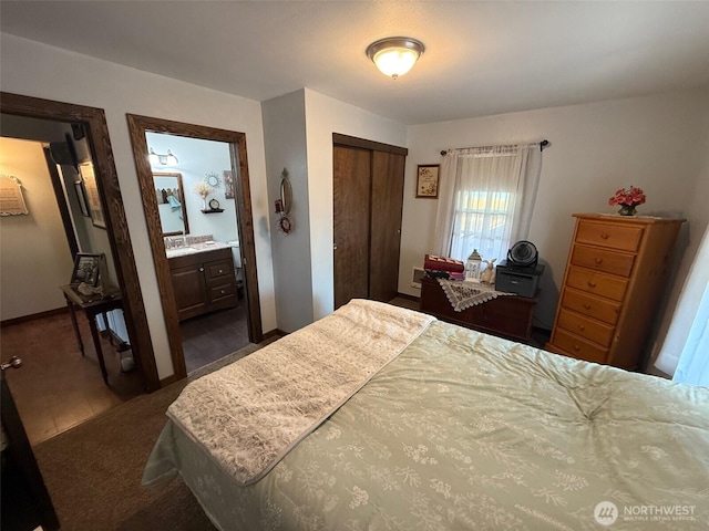 416 Cedar St S, Omak, WA 98841 - bedroom with a closet, ensuite bathroom, and dark carpet